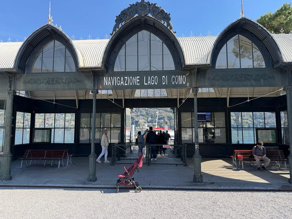 Cernobbio is another Lake Como Town that has amazing views. Here is the waterfront ferry terminal and ticket office in Cernobbio, Lake Como, Italy, on a sunny spring day.