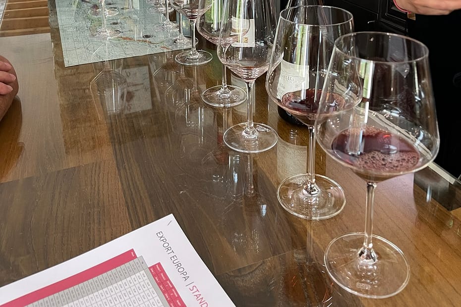 Wine glasses on the bar at Nera Vini during a Valtellina wine tour from Lake Como.