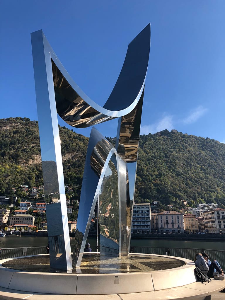 The Life Electric sculpture by Daniel Libeskind on the Lake Como pier at sunset