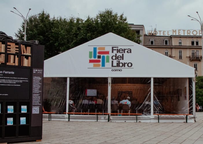 Promotional graphic for the 74th Fiera del Libro di Como, Como's annual book fair held in Piazza Cavour through September 13, 2026