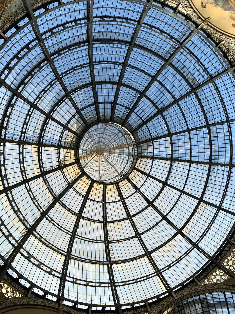 Close-up of the ornate glass and iron dome roof of the Galleria Vittorio Emanuele II in Milan