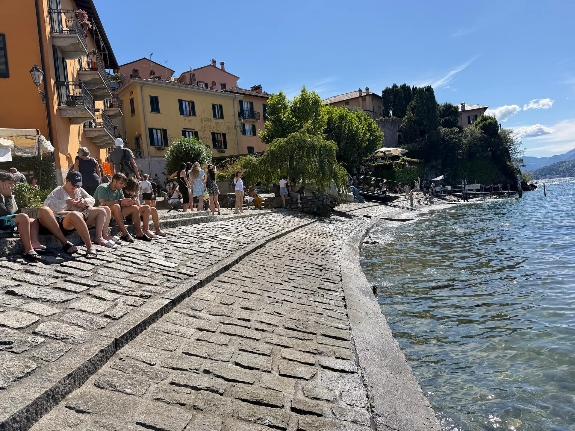 Varenna's lakefront promenade seen from land on Lake Como